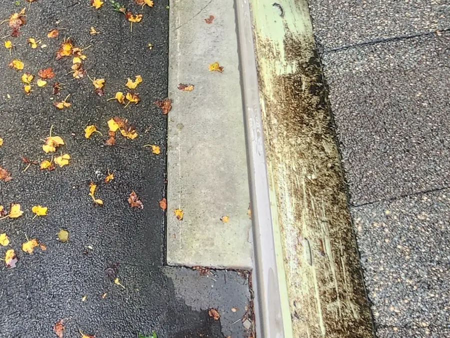 Gutter channel stained and dirty before cleaning in Hardy, VA