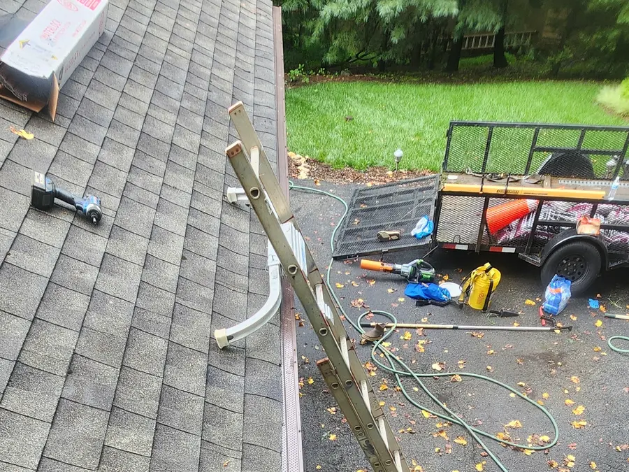 Trailer, ladder and tools on site during a gutter guard installation in Hardy, VA