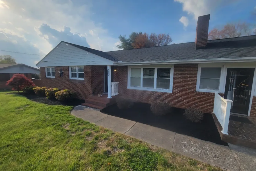 Fresh mulch bed curved along the front walk in Vinton, VA