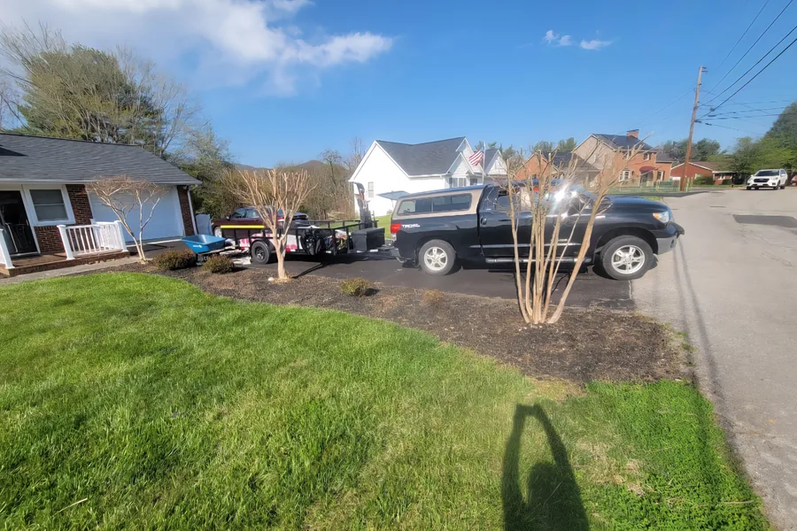 Truck and trailer on site during a mulch installation in Vinton, VA